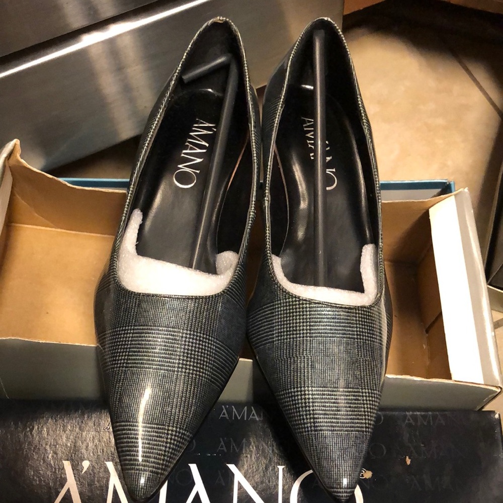 Unworn, all synthetic lady’s inch and a half heels.  Blue and black herringbone.